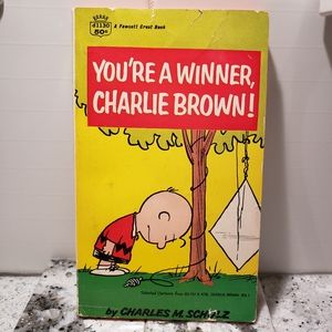 Vintage 1960 Peanunts book. You're a Winner Charlie Brown.